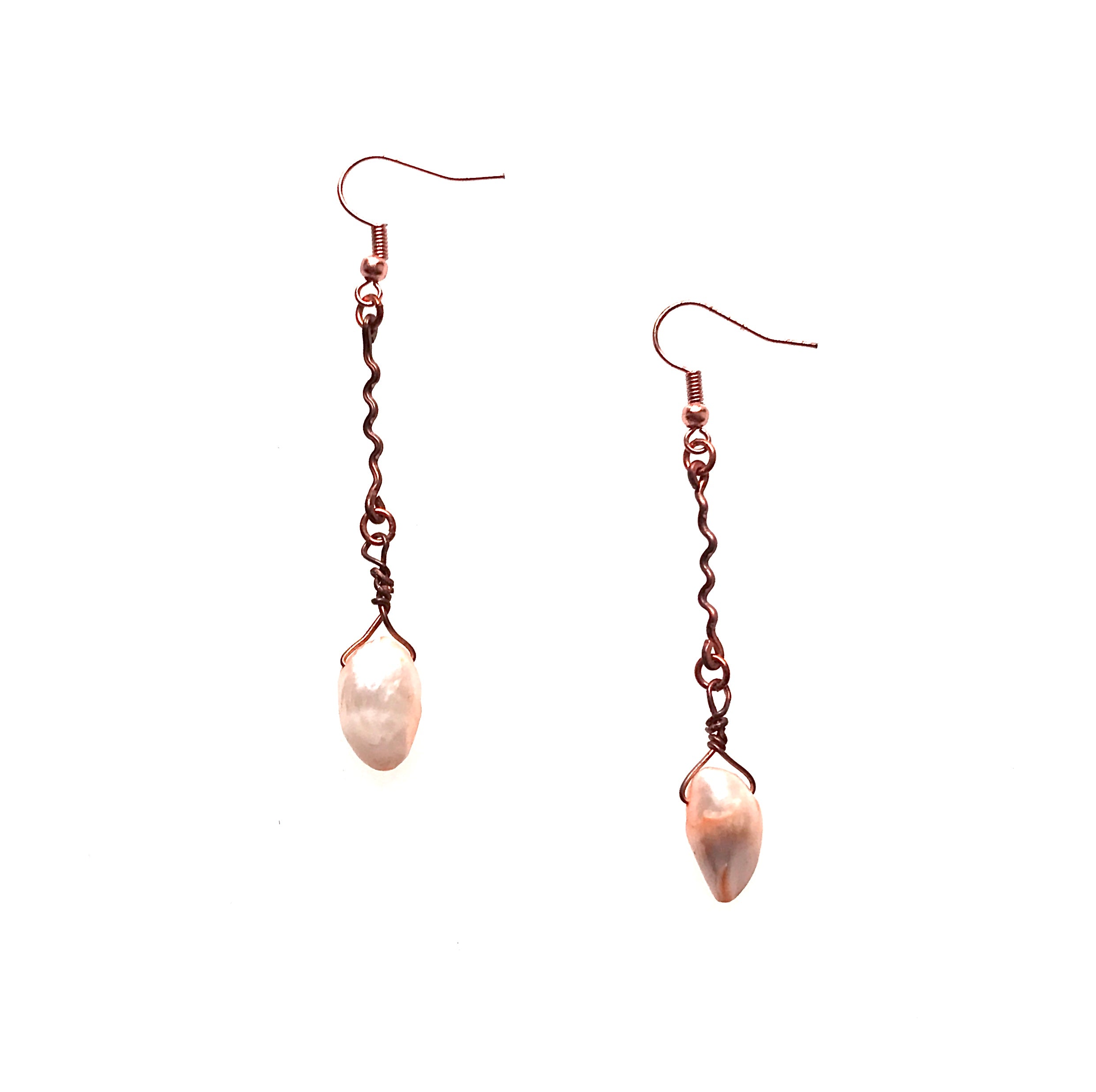 Shows copper and pearl drop earrings featuring squiggly copper wire with a dangling, teardrop-shape peach-colored pearl.