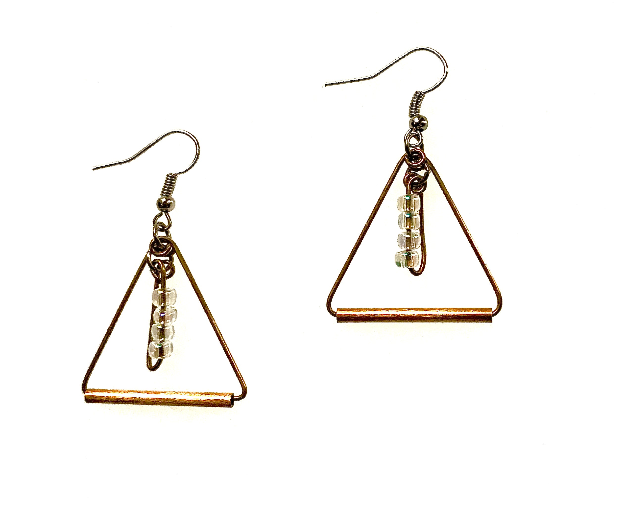 A pair of triangle-shaped brass earrings with clear seed beads dangling in center. Earrings have earwires.